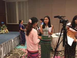 Hla San Htwe and Khin Sandar Win being interviewed by the media